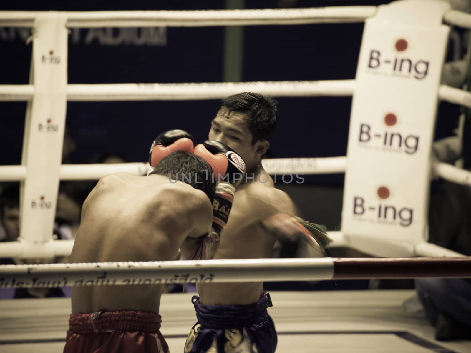 BANGKOK, THAILAND- OCTOBER 04 : Unidentified boxers compete in Thai Fight: Muay Thai Charity on October 04, 2012 at Rajadamnern Stadium in Bangkok, Thailand