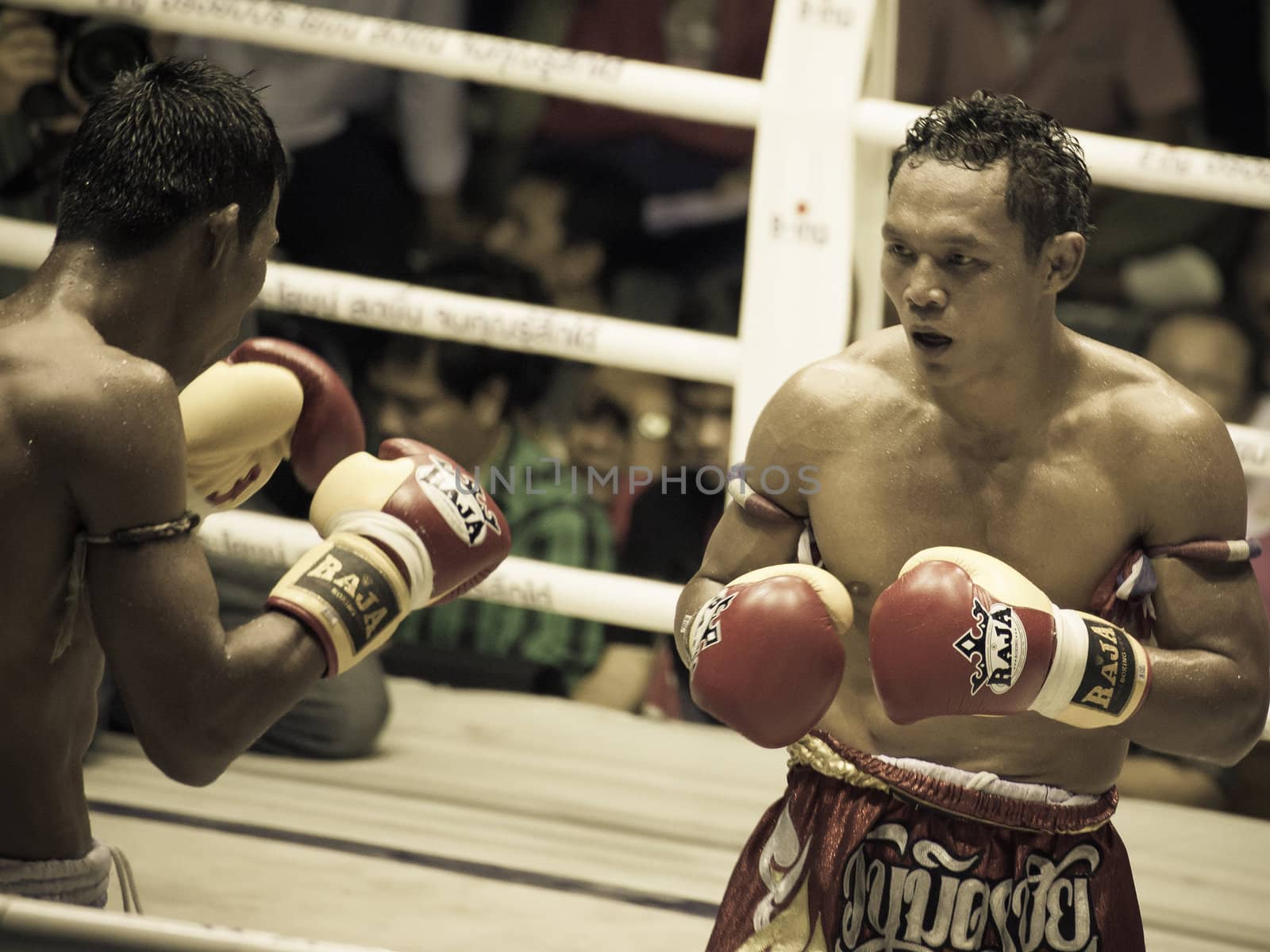 BANGKOK, THAILAND- OCTOBER 04 : Unidentified boxers compete in Thai Fight: Muay Thai Charity on October 04, 2012 at Rajadamnern Stadium in Bangkok, Thailand