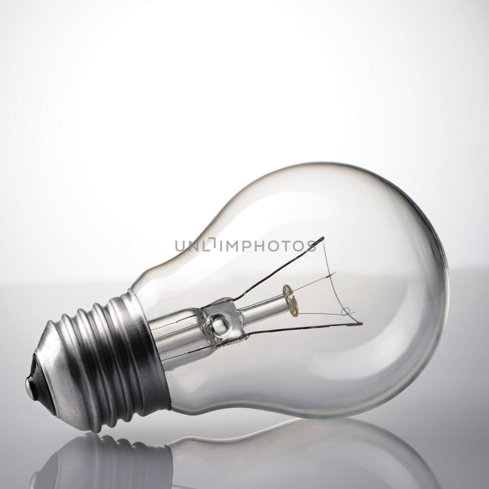 Light Bulb over grey background