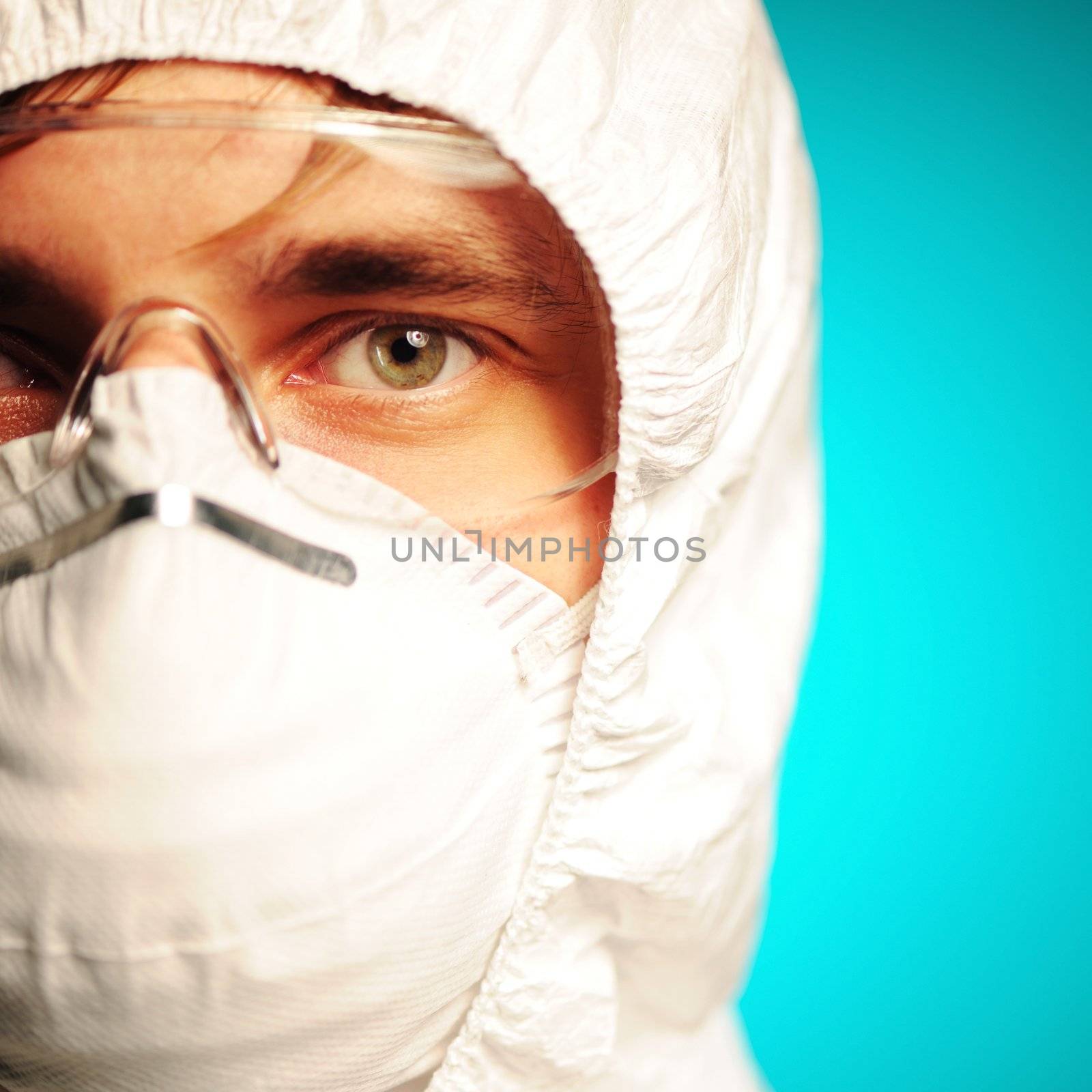 Scientist in protective wear, glasses and respirator 