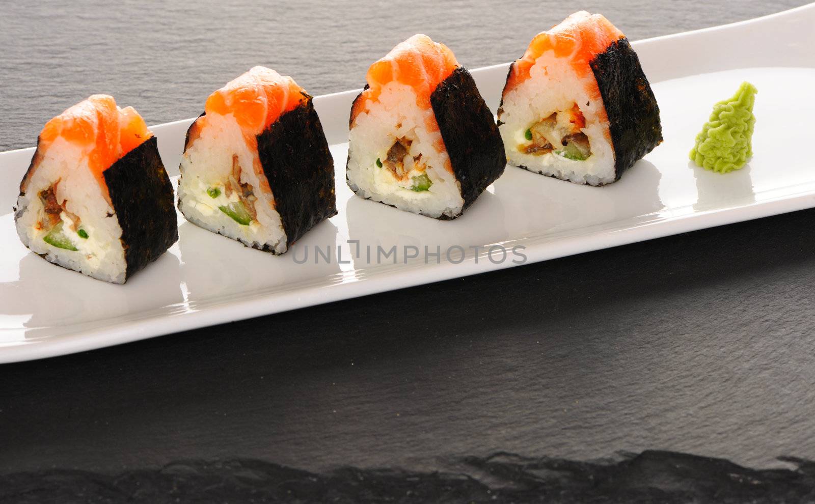 Sushi rolls on a slate plate