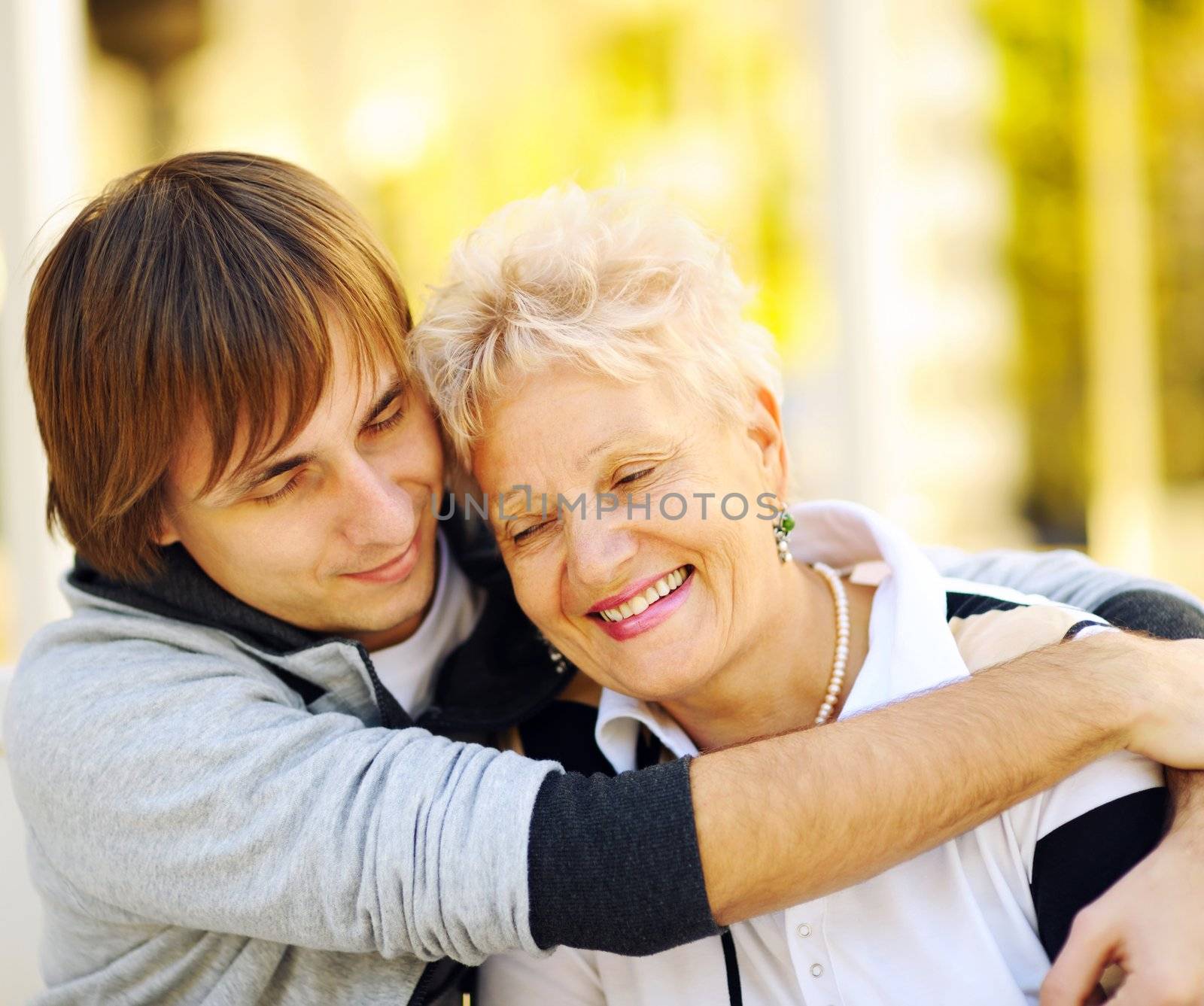 Mother and son having a hug