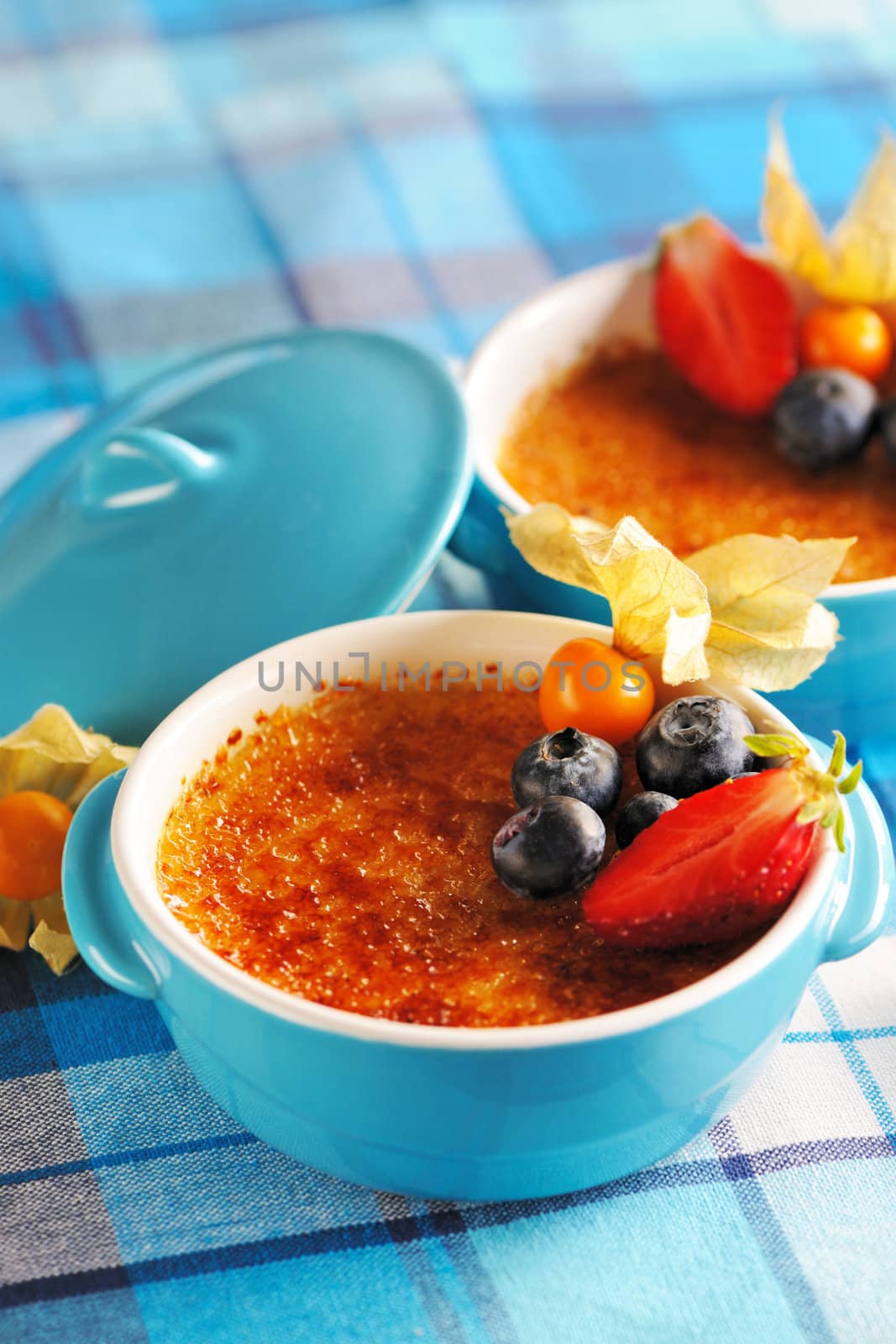 Creme brulee (cream brulee, burnt cream) with fruits and berries