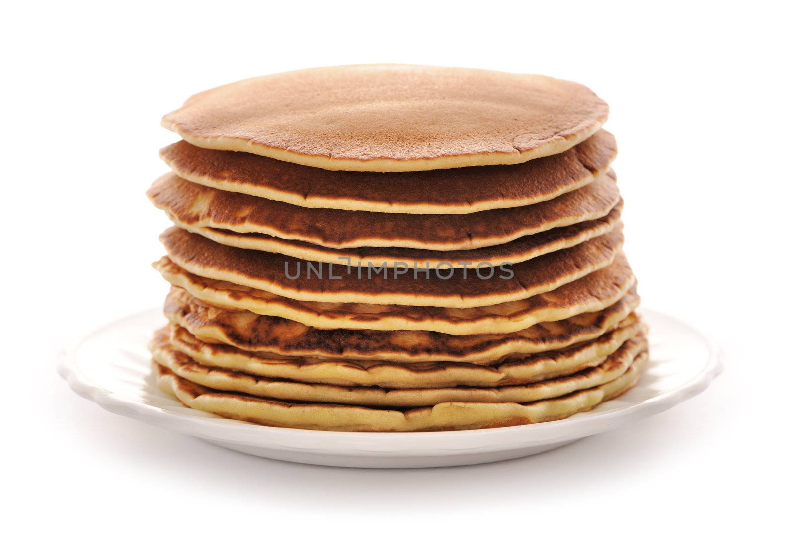 Delicious freshly prepared pancakes isolated on white