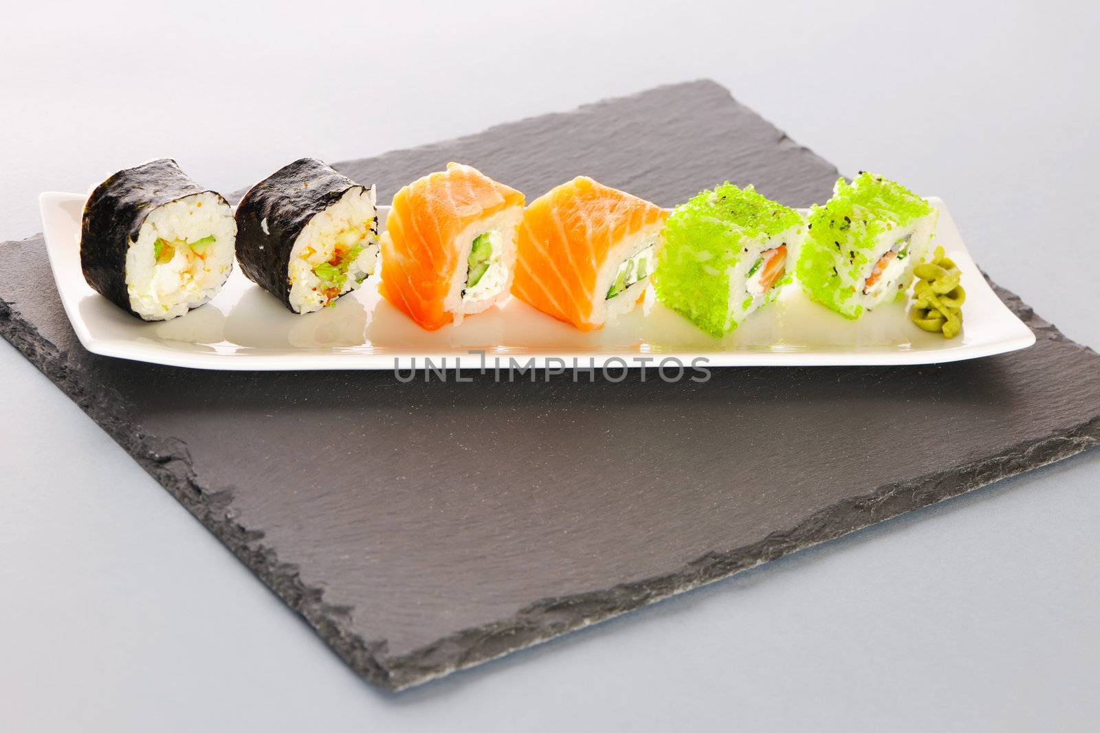 Sushi rolls on a slate plate