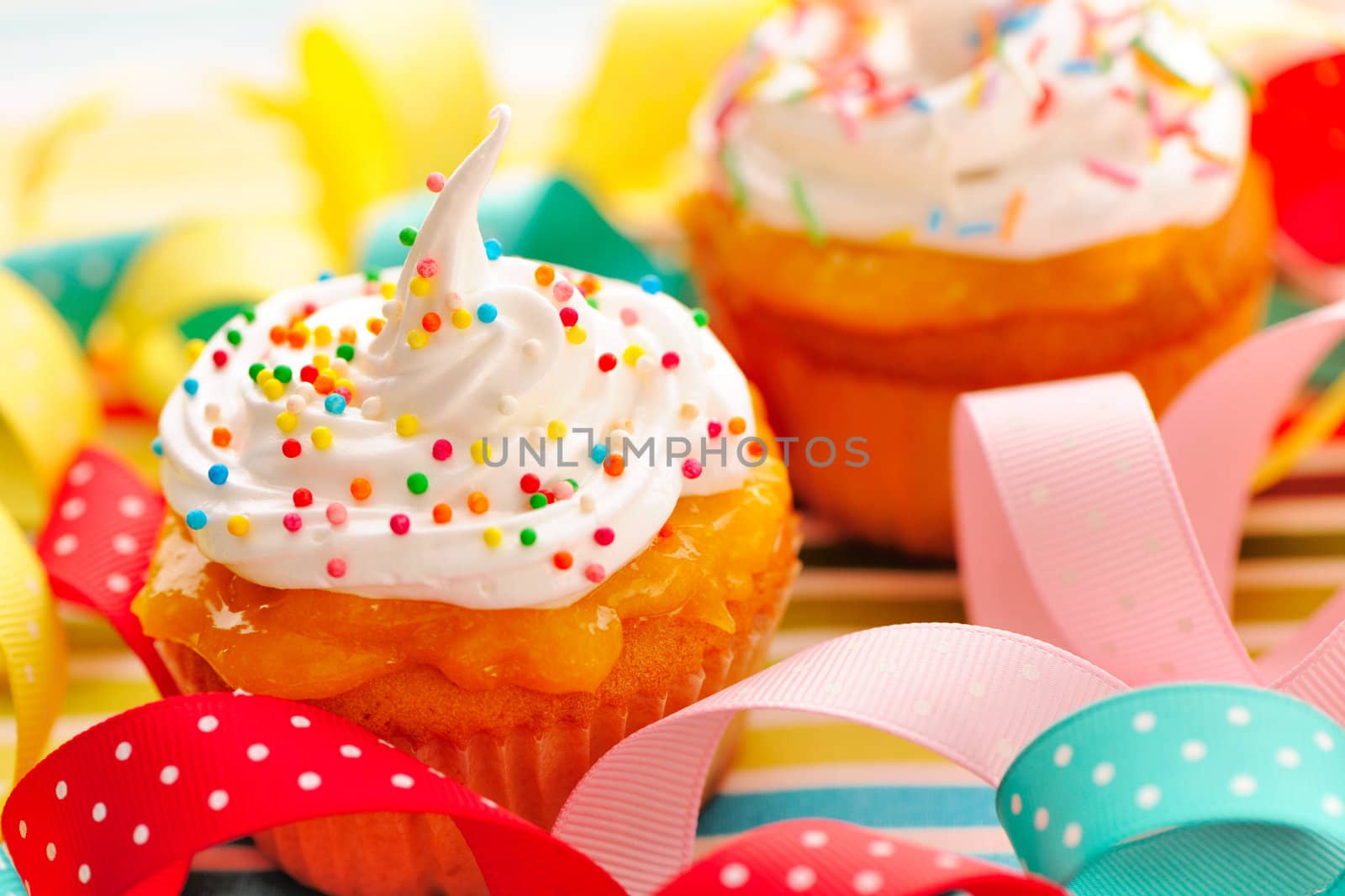 Cupcakes with whipped cream and icing