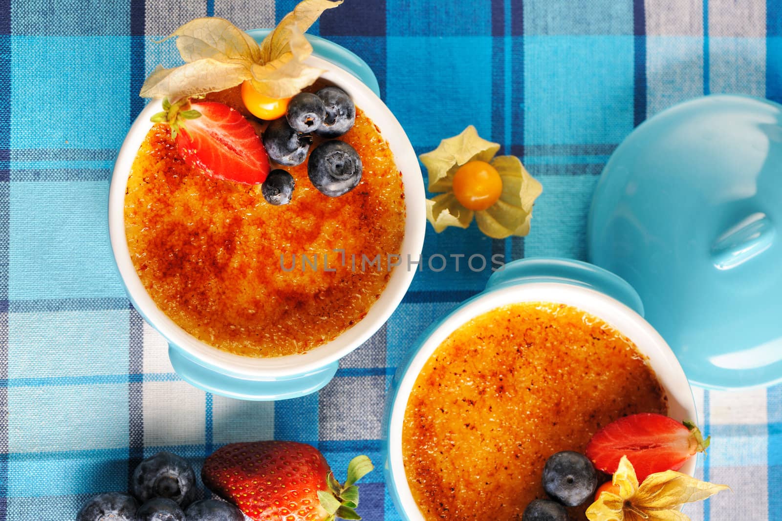 Creme brulee (cream brulee, burnt cream) with fruits and berries