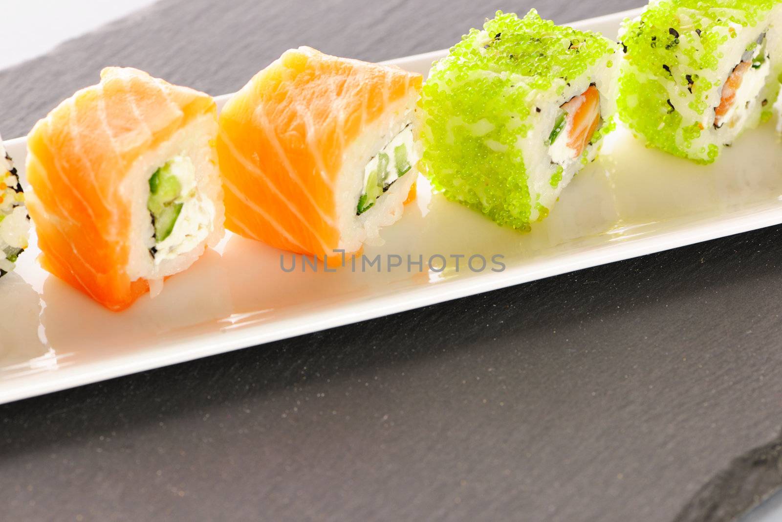 Sushi rolls on a slate plate