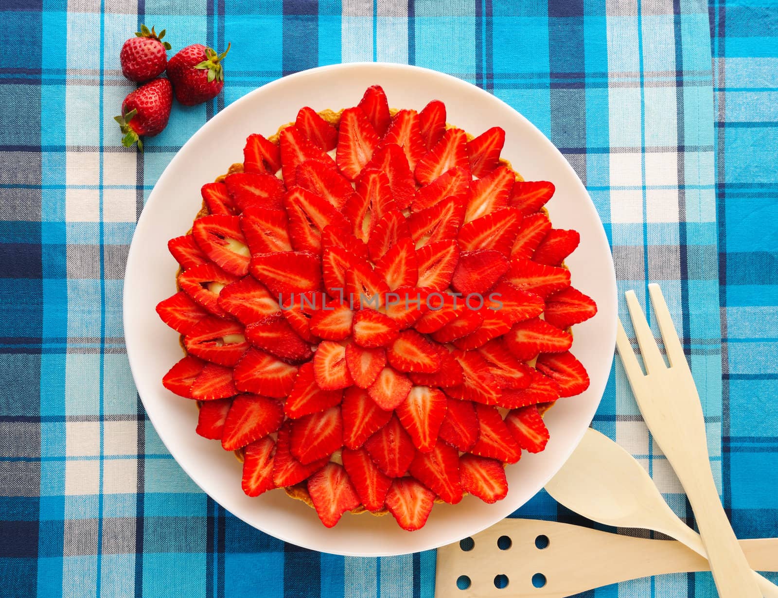 Homemade strawberry tart on table
