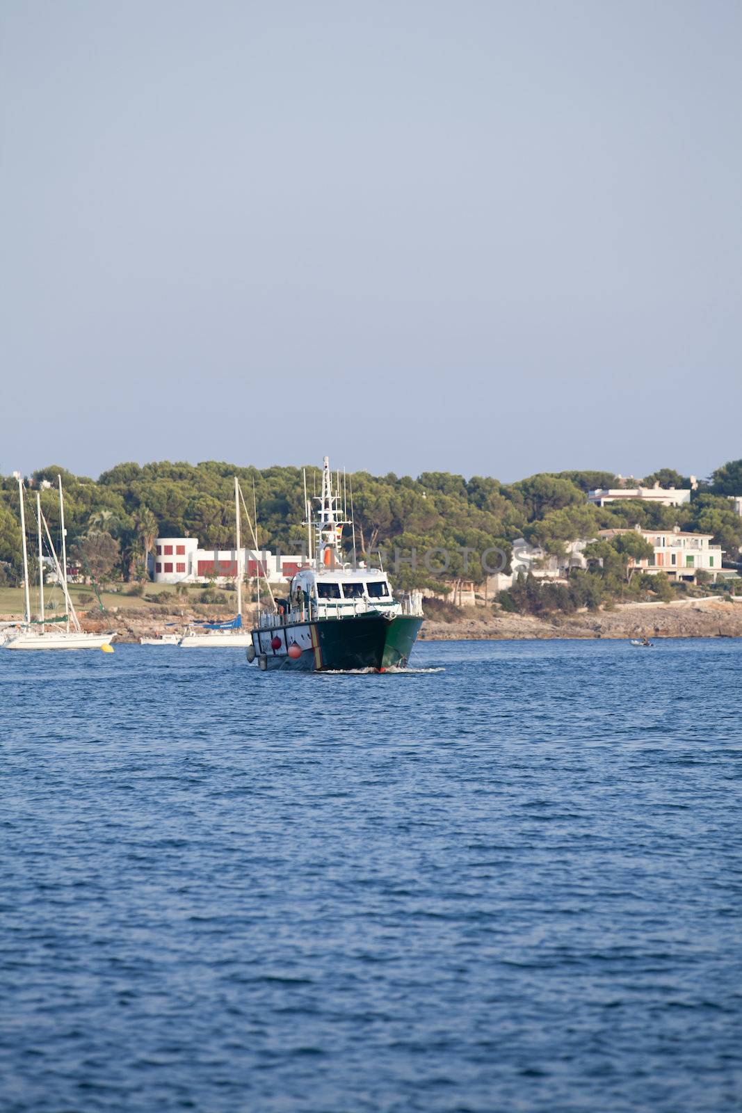 fishing boat in summer outside in sea at harbour background