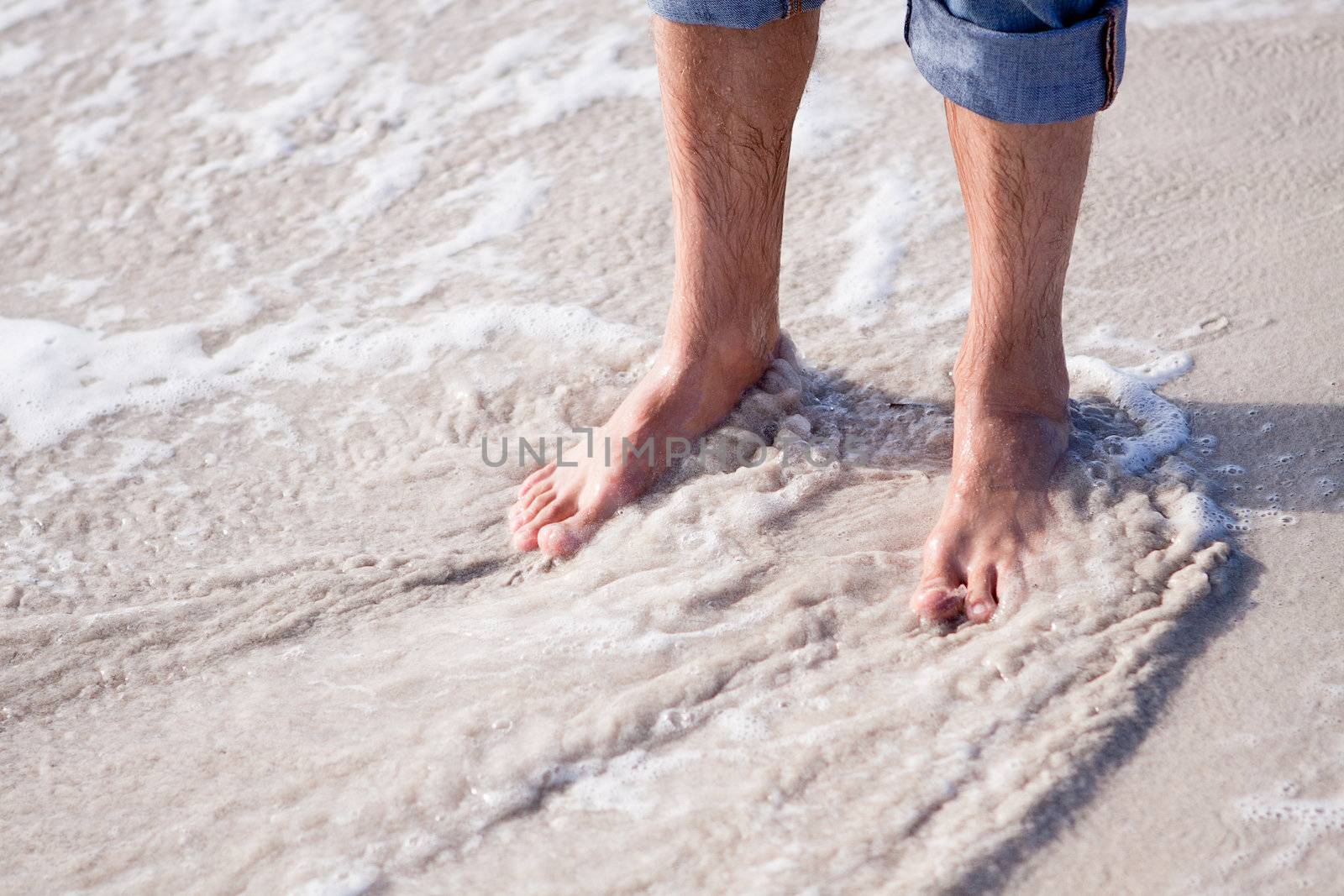 barefoot in the sand in summer holidays relaxing by juniart