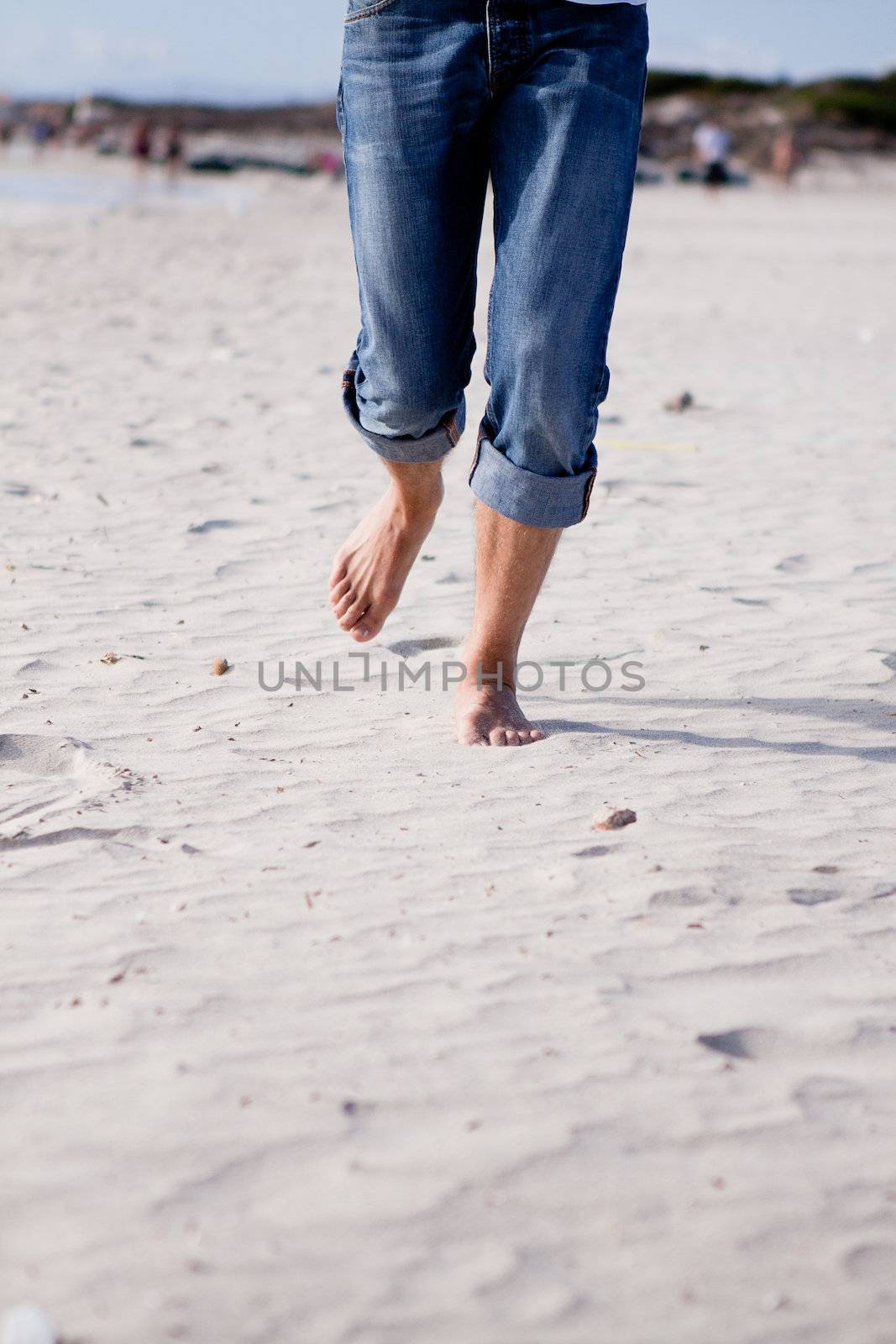 barefoot in sand and water on beach  in summer holidays relaxing