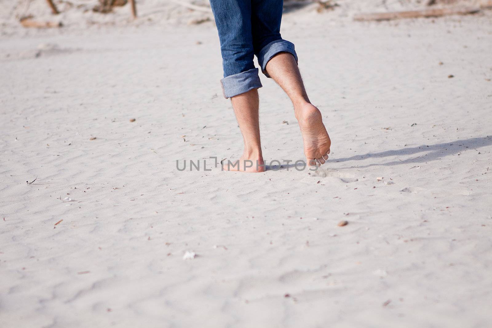 barefoot in sand and water on beach  in summer holidays relaxing