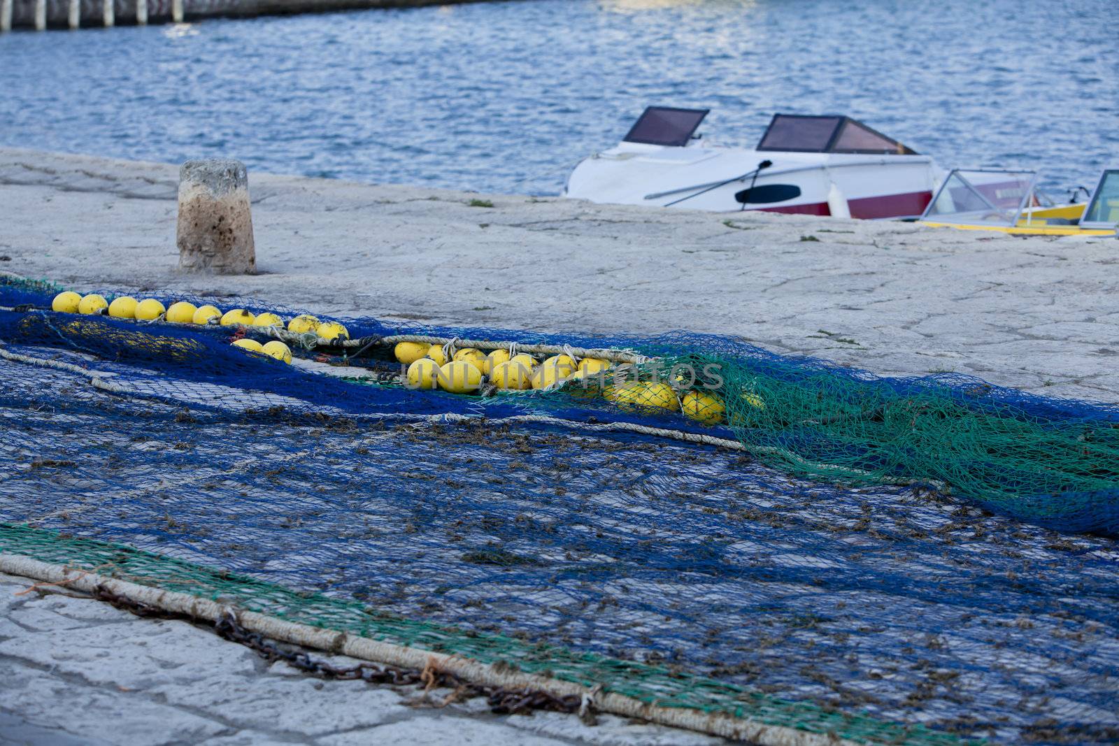 fishnet trawl rope putdoor in summer at harbour by juniart