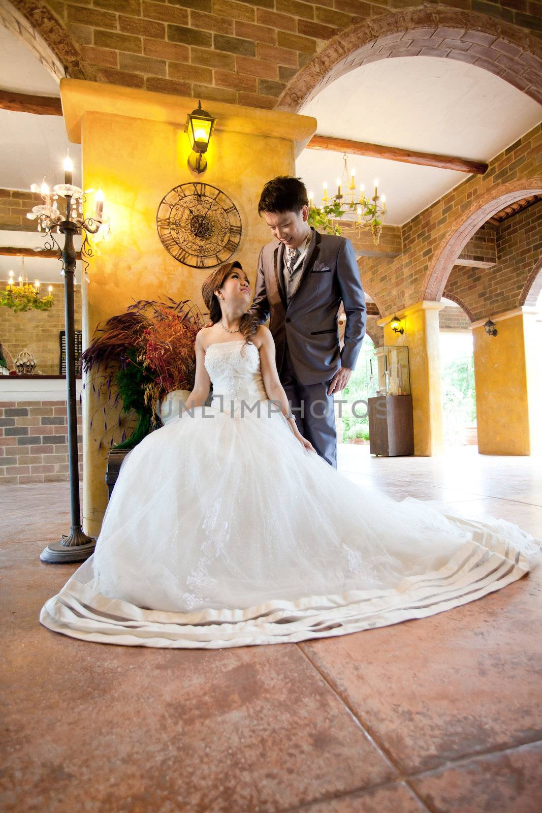 Happiness and romantic newlywed couples in italian style building for wedding background