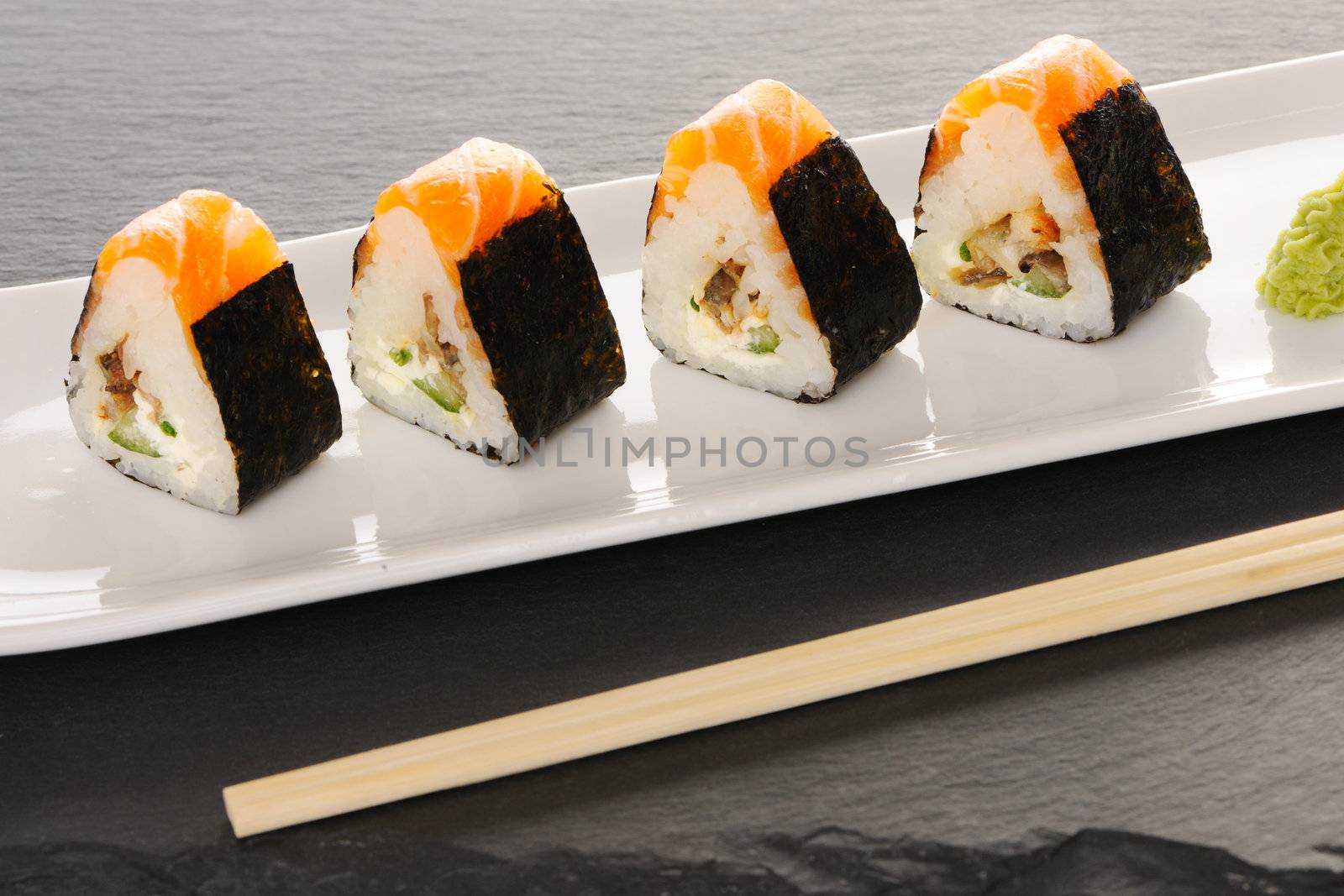 Sushi rolls on a slate plate