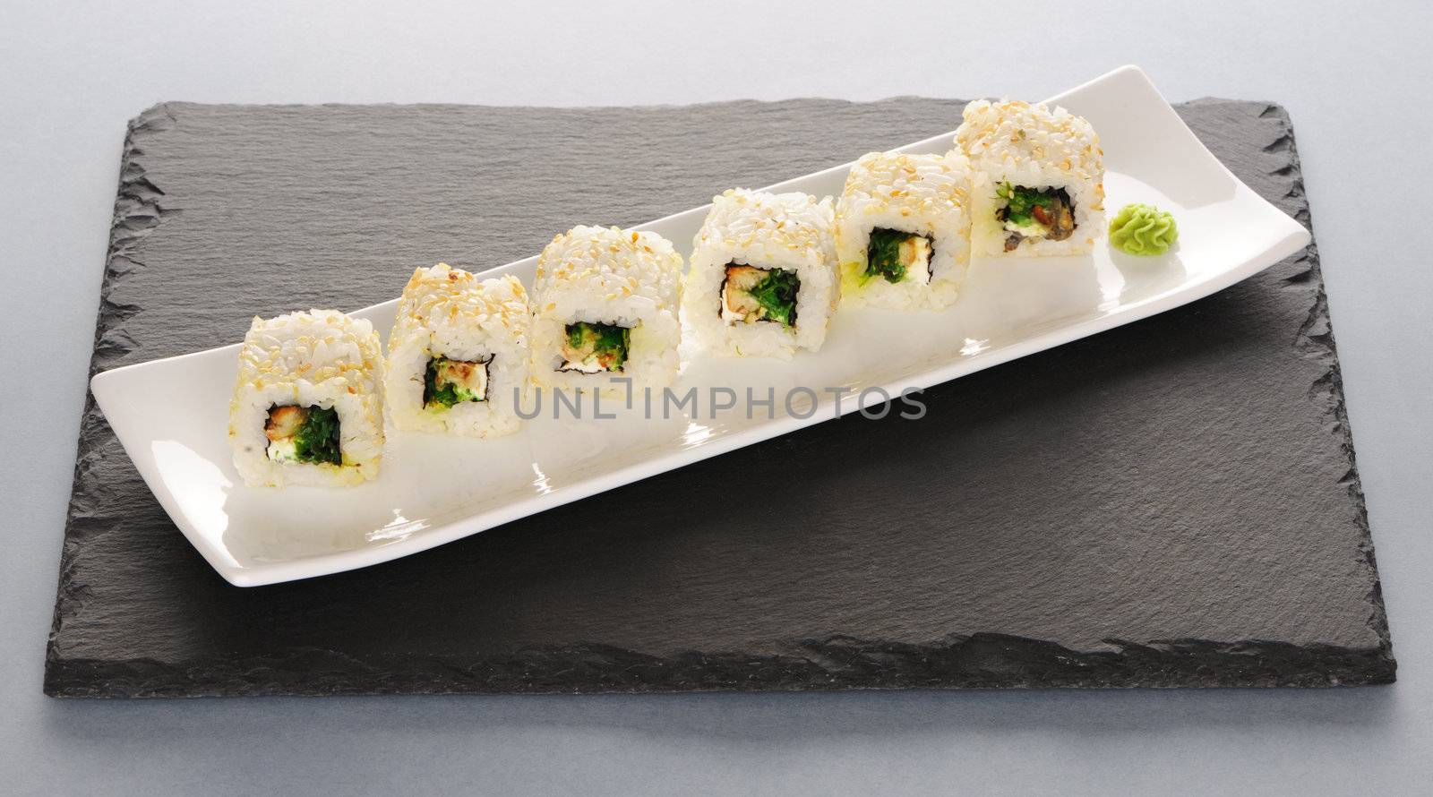 Sushi rolls on a slate plate
