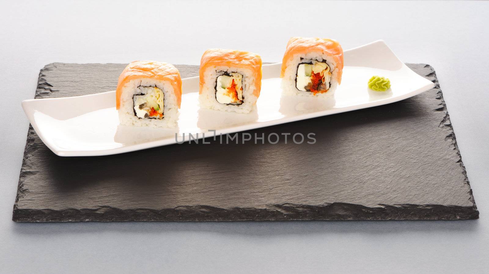 Sushi rolls on a slate plate