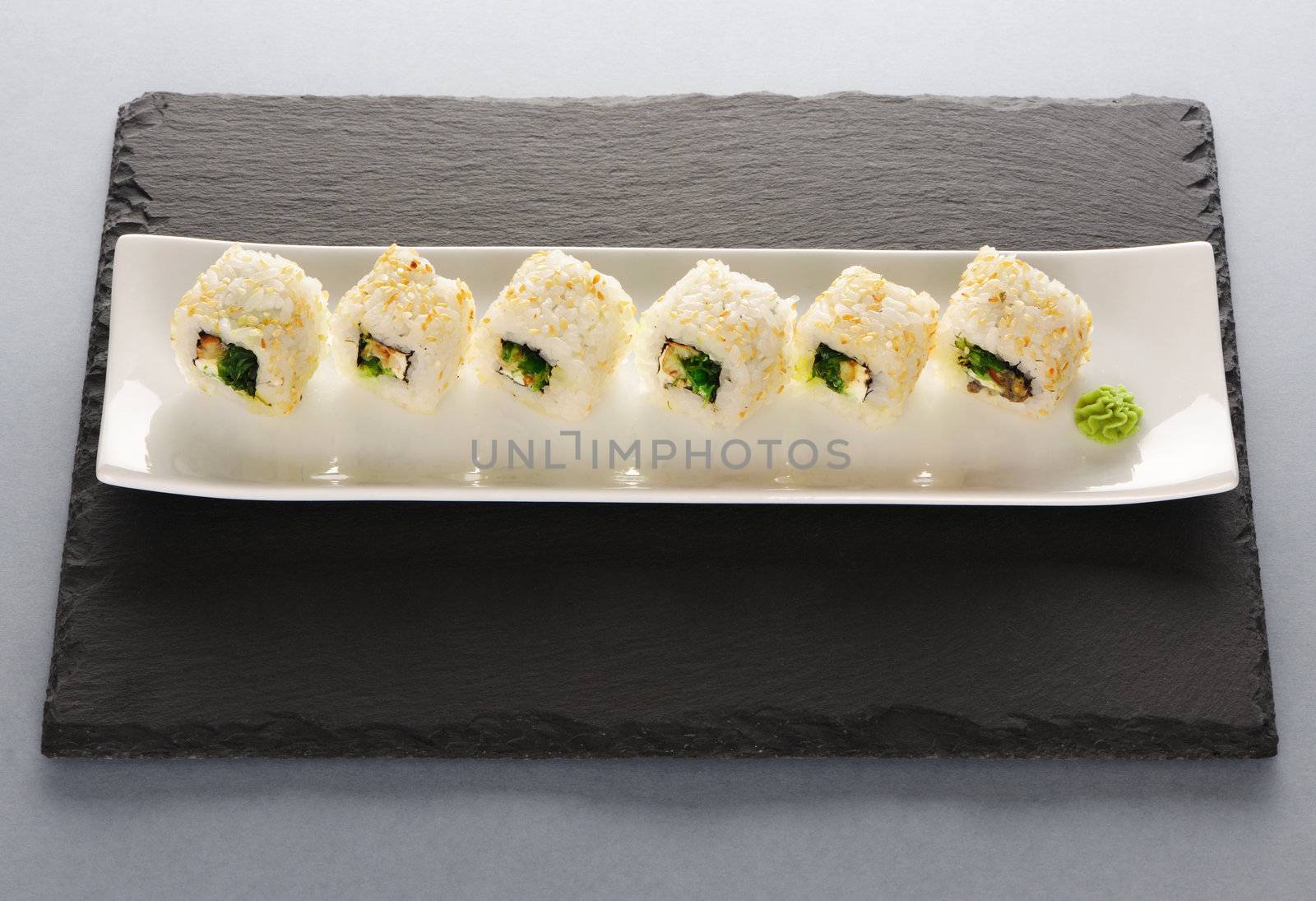 Sushi rolls on a slate plate