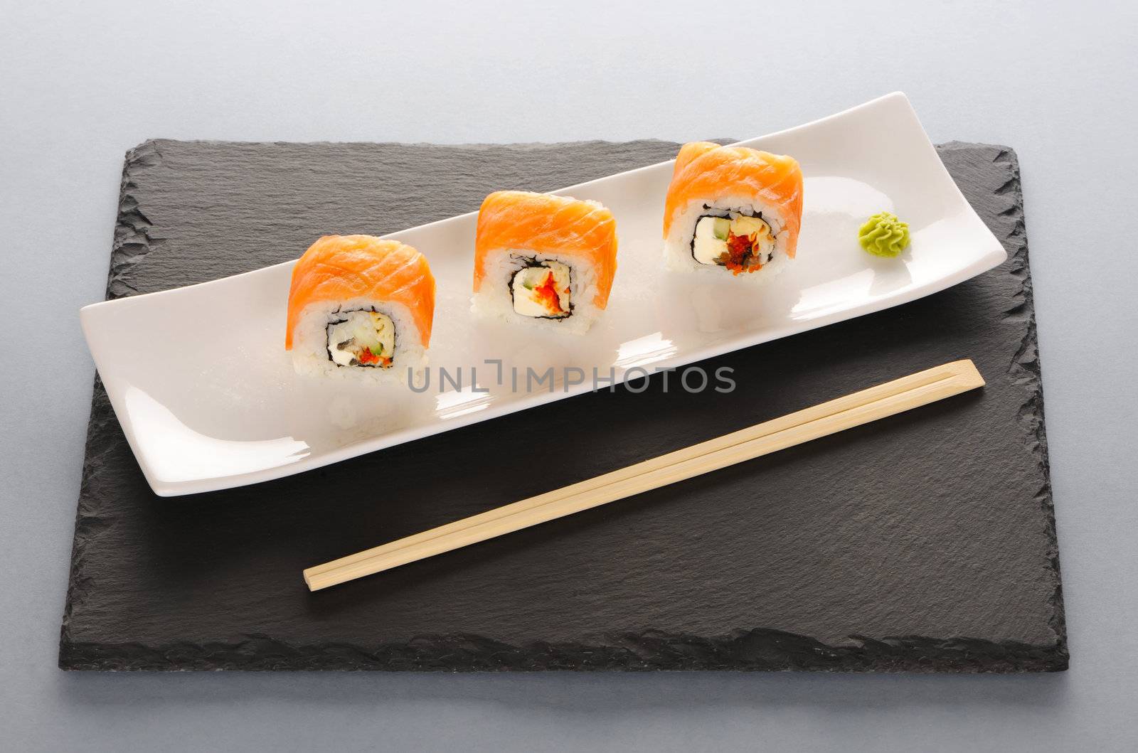 Sushi rolls on a slate plate