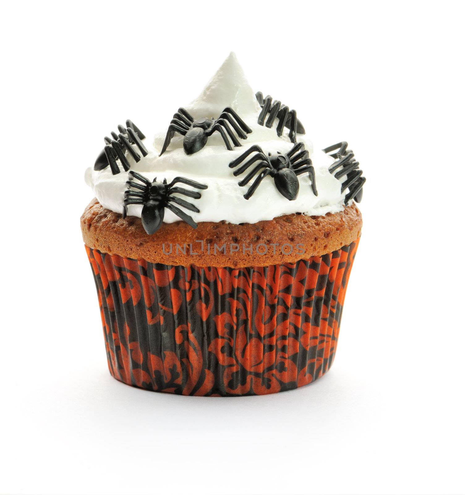 Halloween cupcake with whipped cream and decoration isolated on white