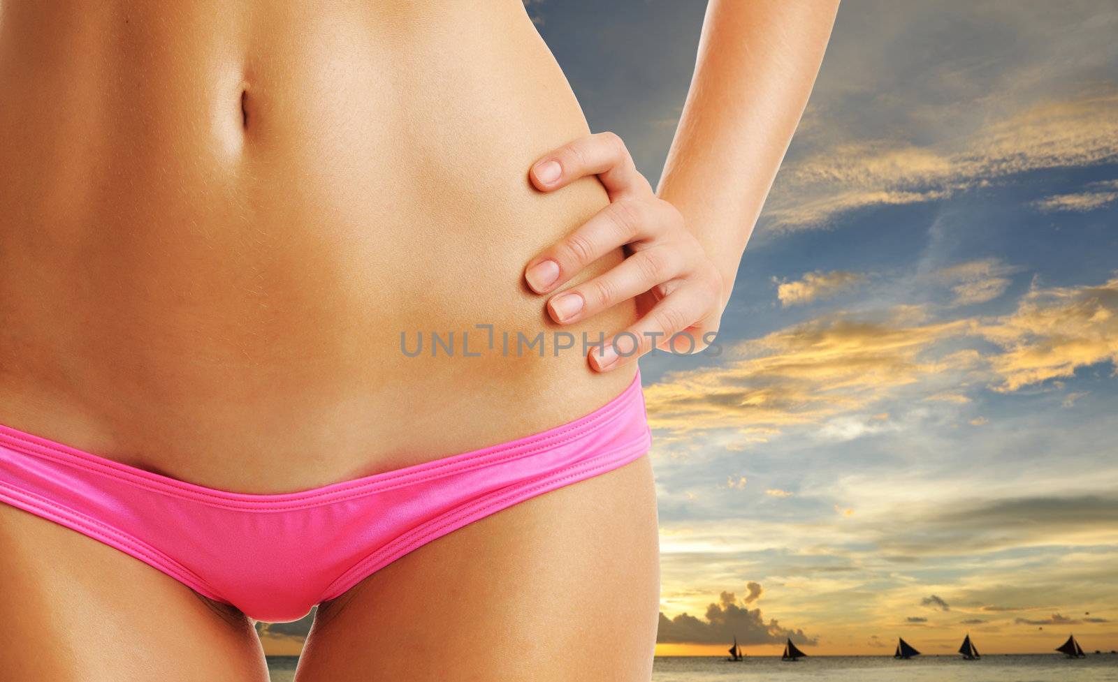 Woman with beautiful body on tropical beach at sunset. Collage.