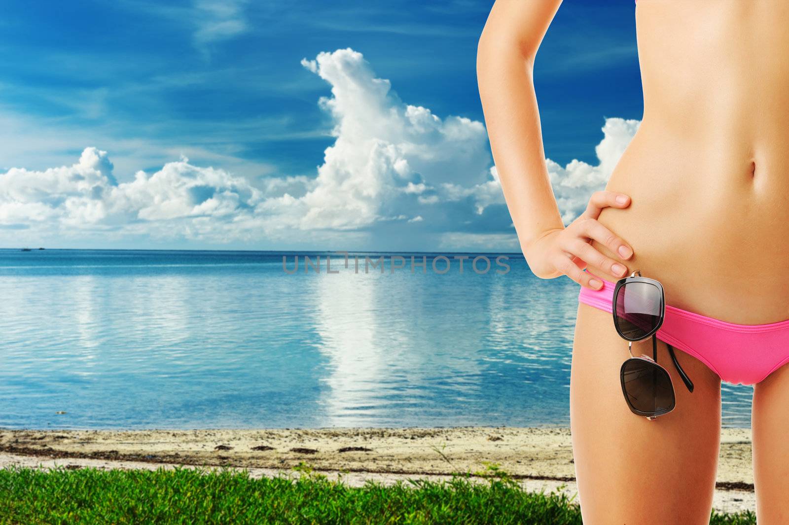 Woman with beautiful body at beach by haveseen