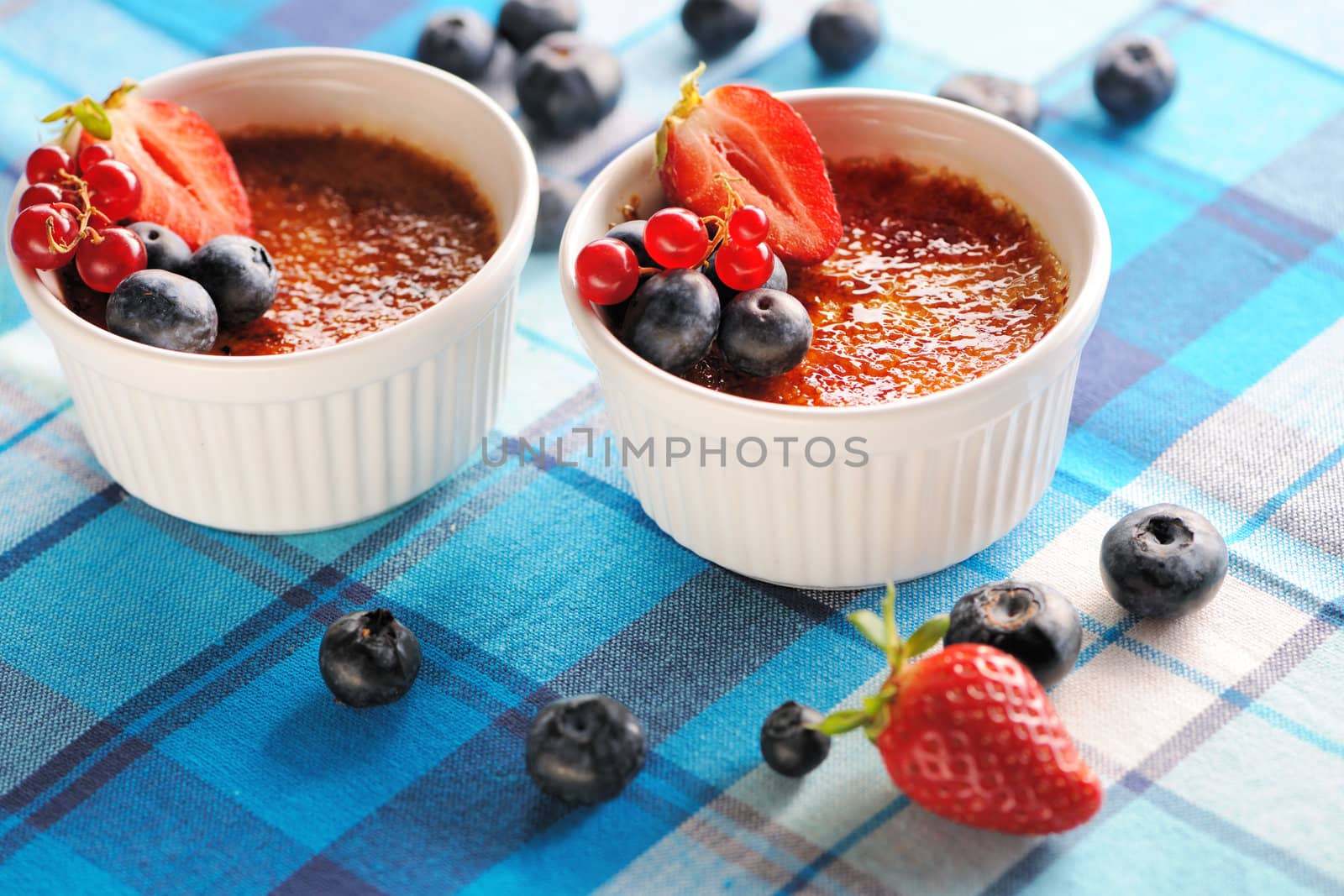 Creme brulee (cream brulee, burnt cream) with fruits and berries