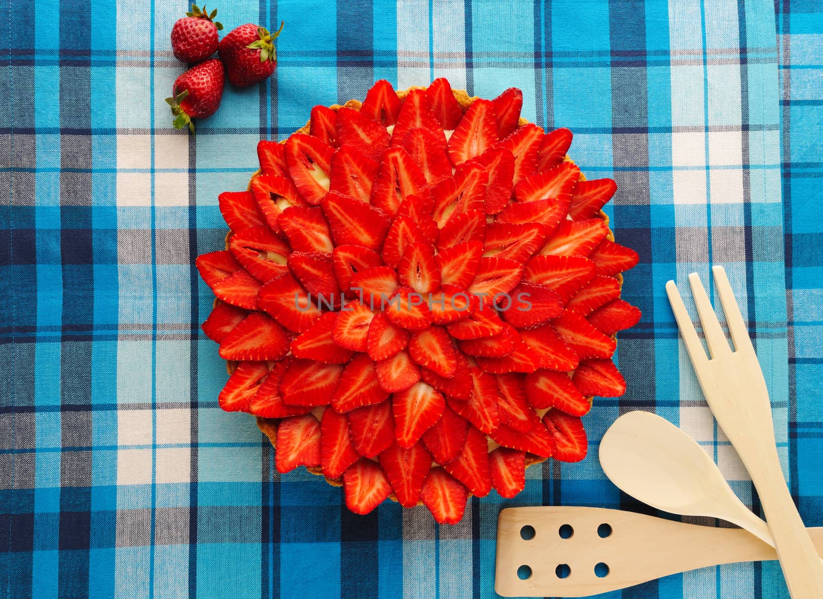 Homemade strawberry tart on table