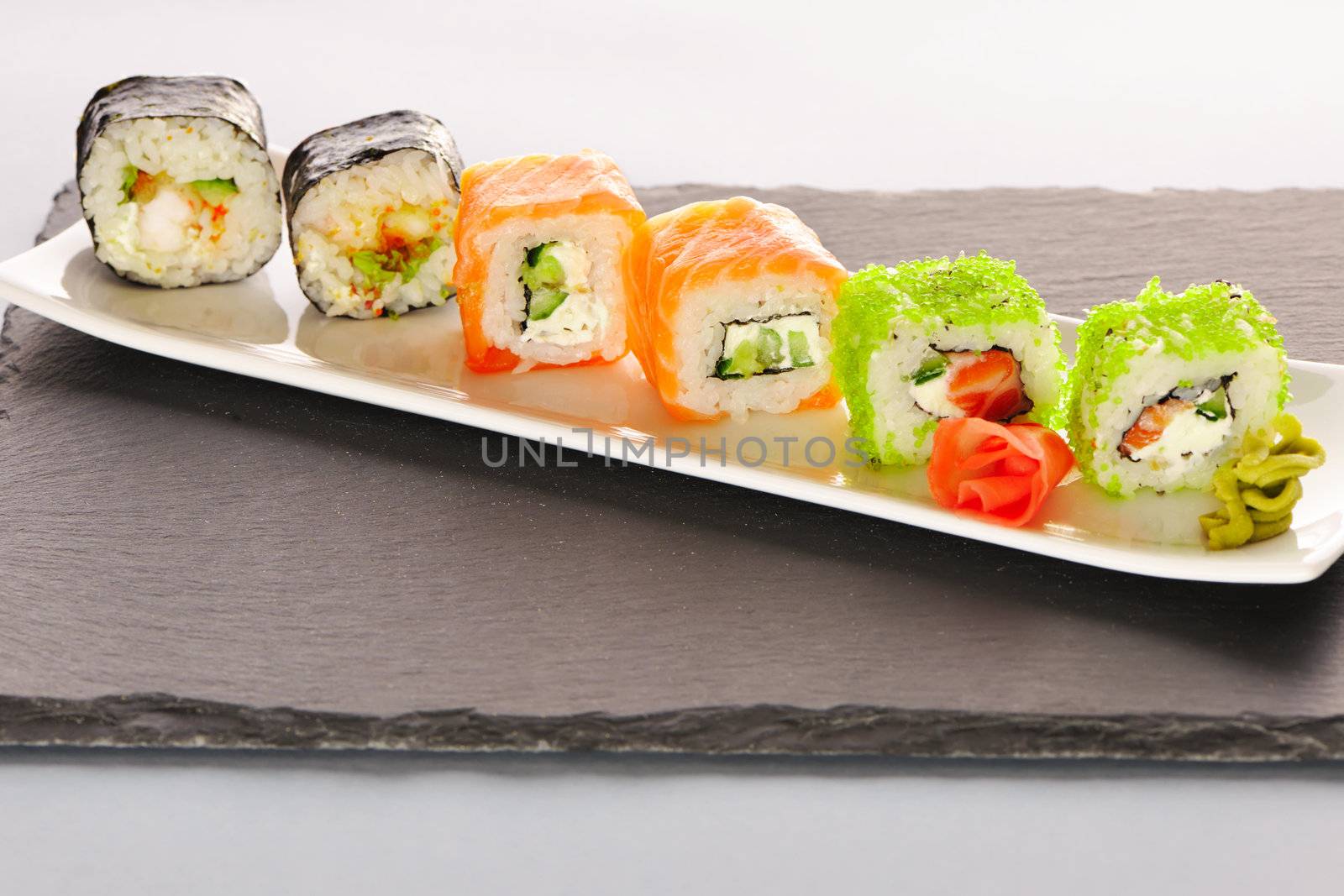 Sushi rolls on a slate plate