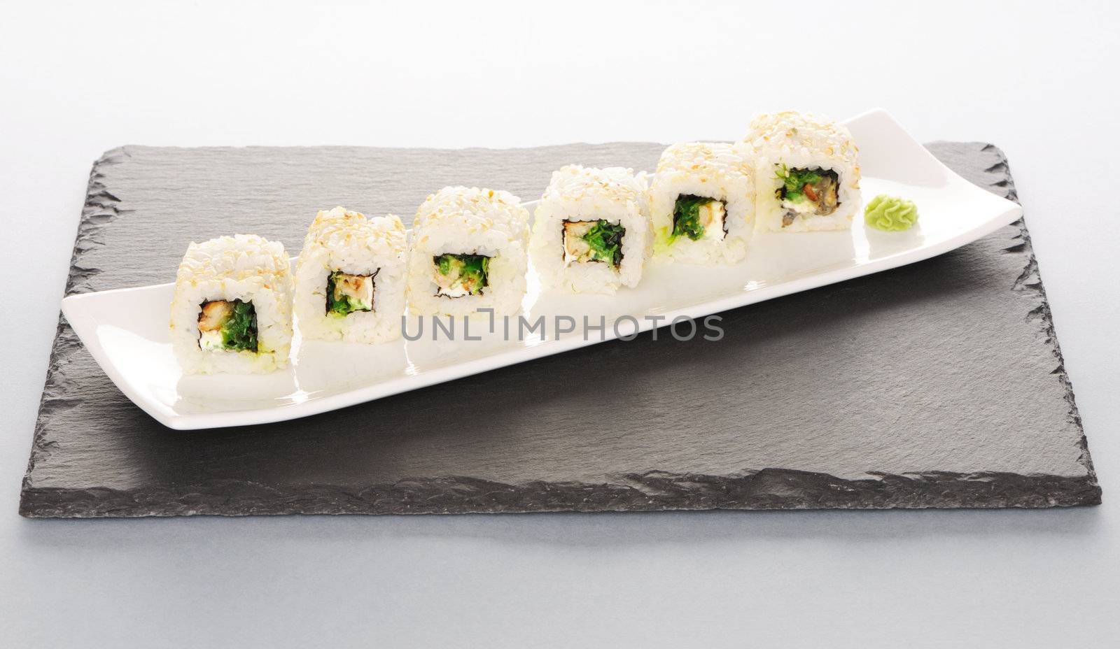Sushi rolls on a slate plate
