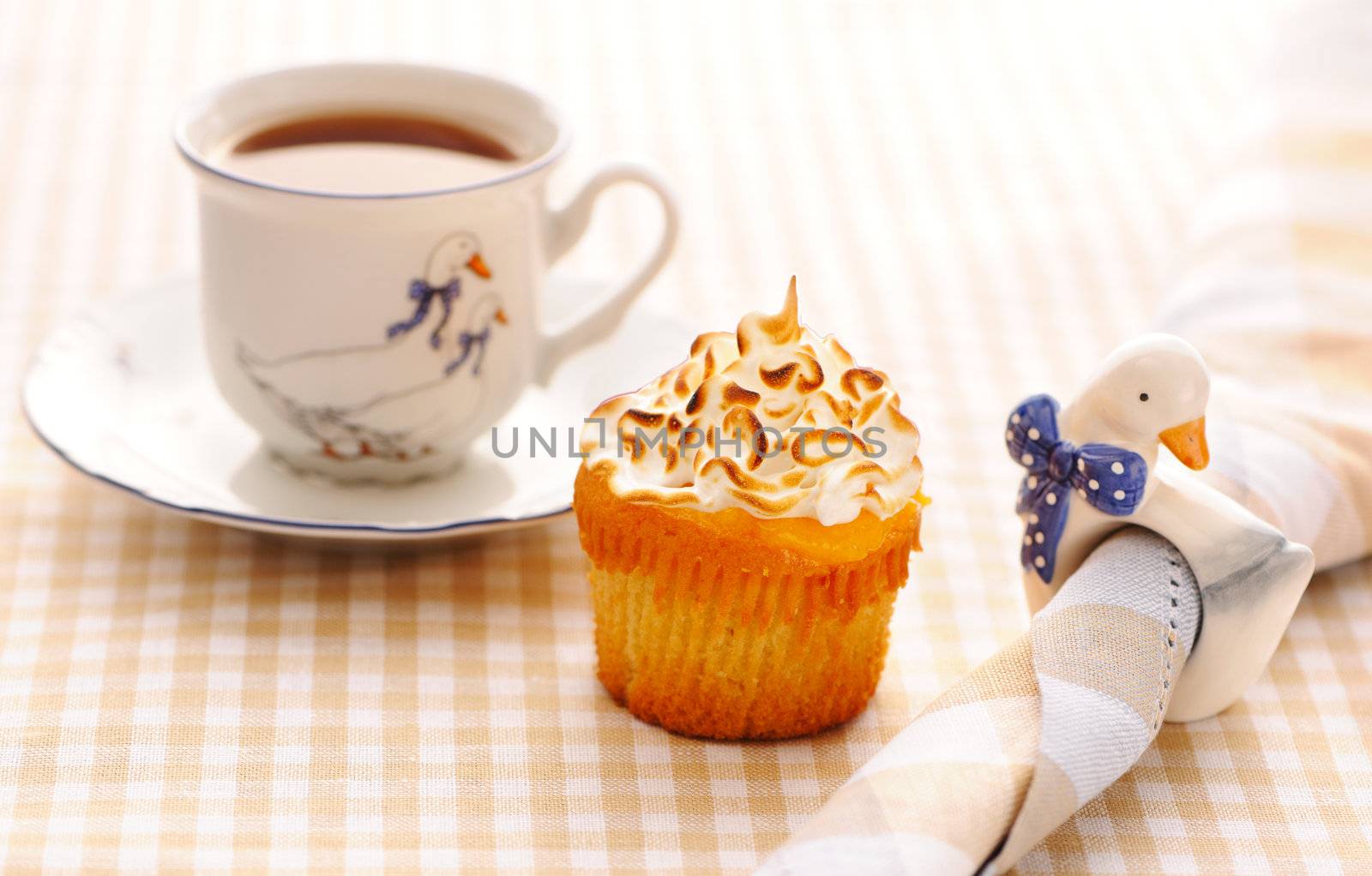 Cupcake with whipped cream and icing