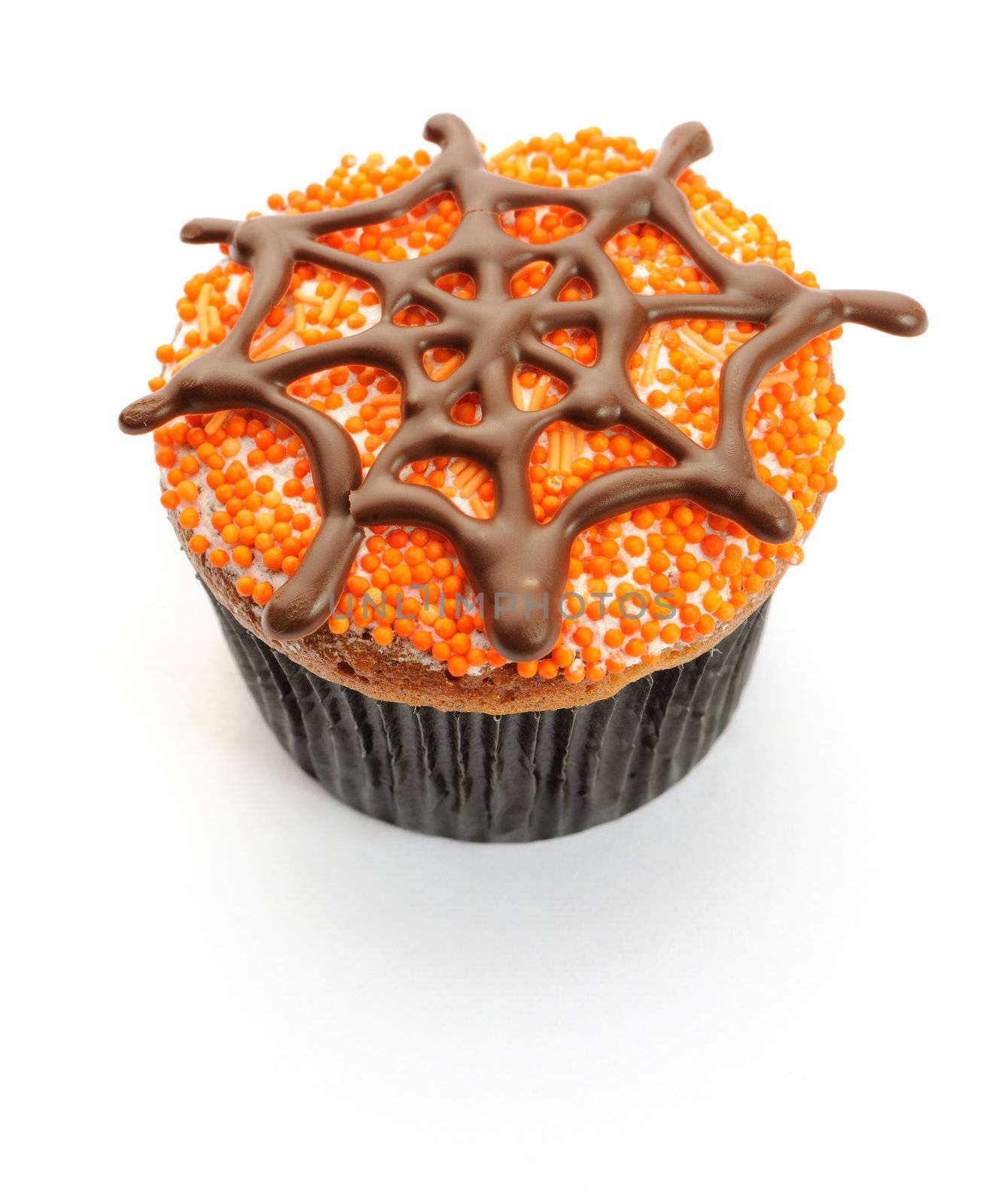 Halloween cupcake with decoration isolated on white