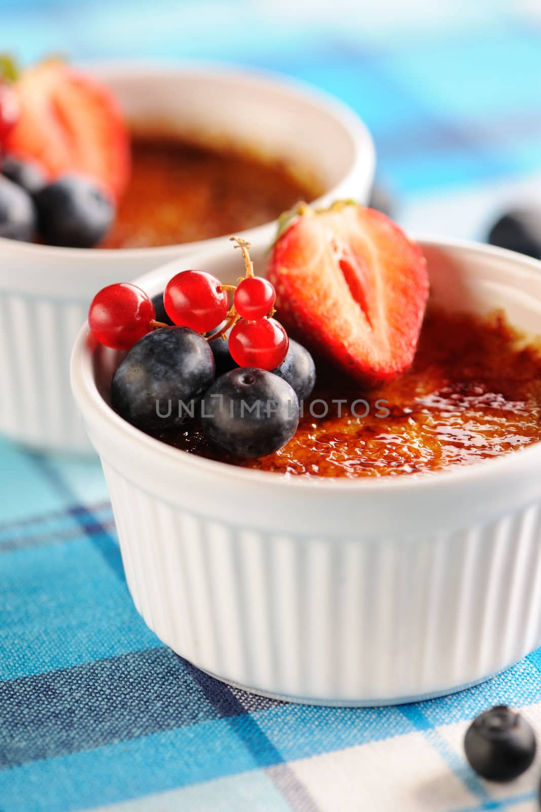 Creme brulee (cream brulee, burnt cream) with fruits and berries