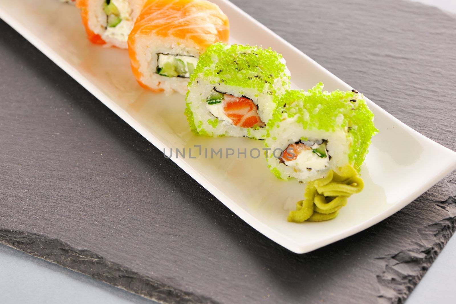 Sushi rolls on a slate plate