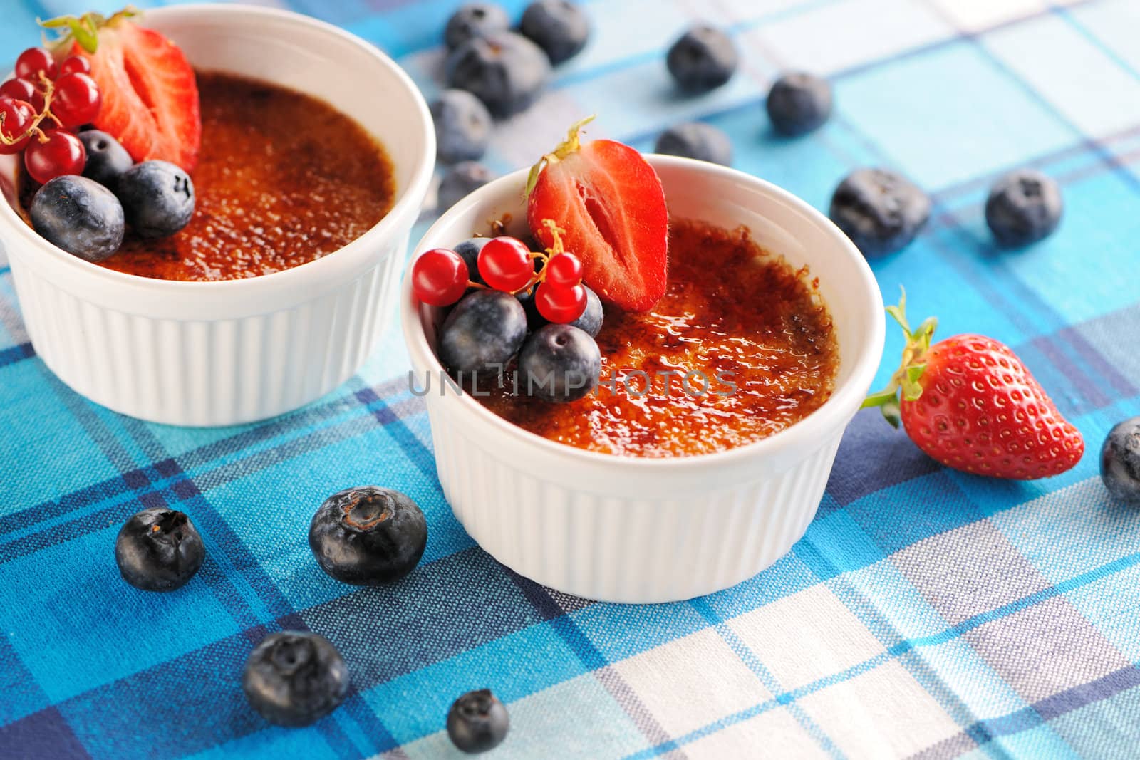 Creme brulee (cream brulee, burnt cream) with fruits and berries