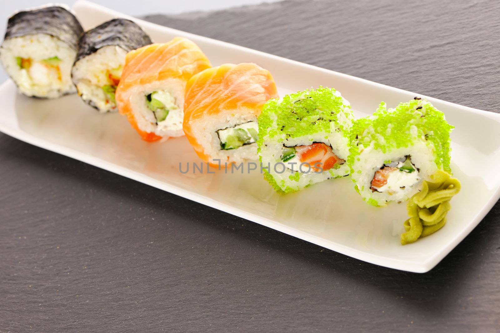 Sushi rolls on a slate plate