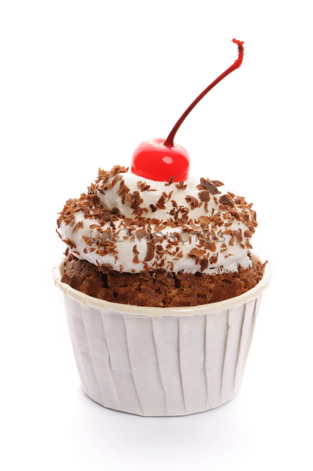 Cupcake with whipped cream and cherry isolated on white