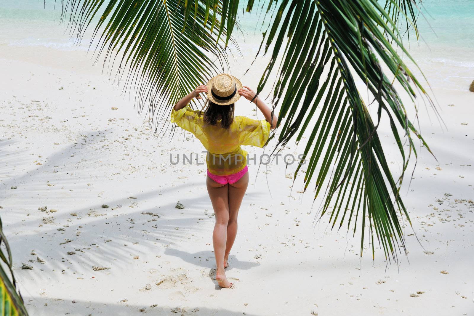 Woman at beach wearing hat