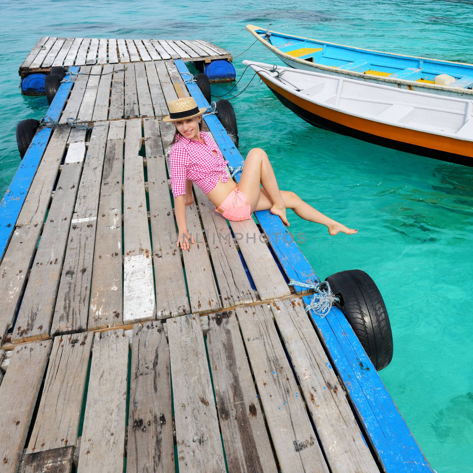 Woman at beach jetty by haveseen