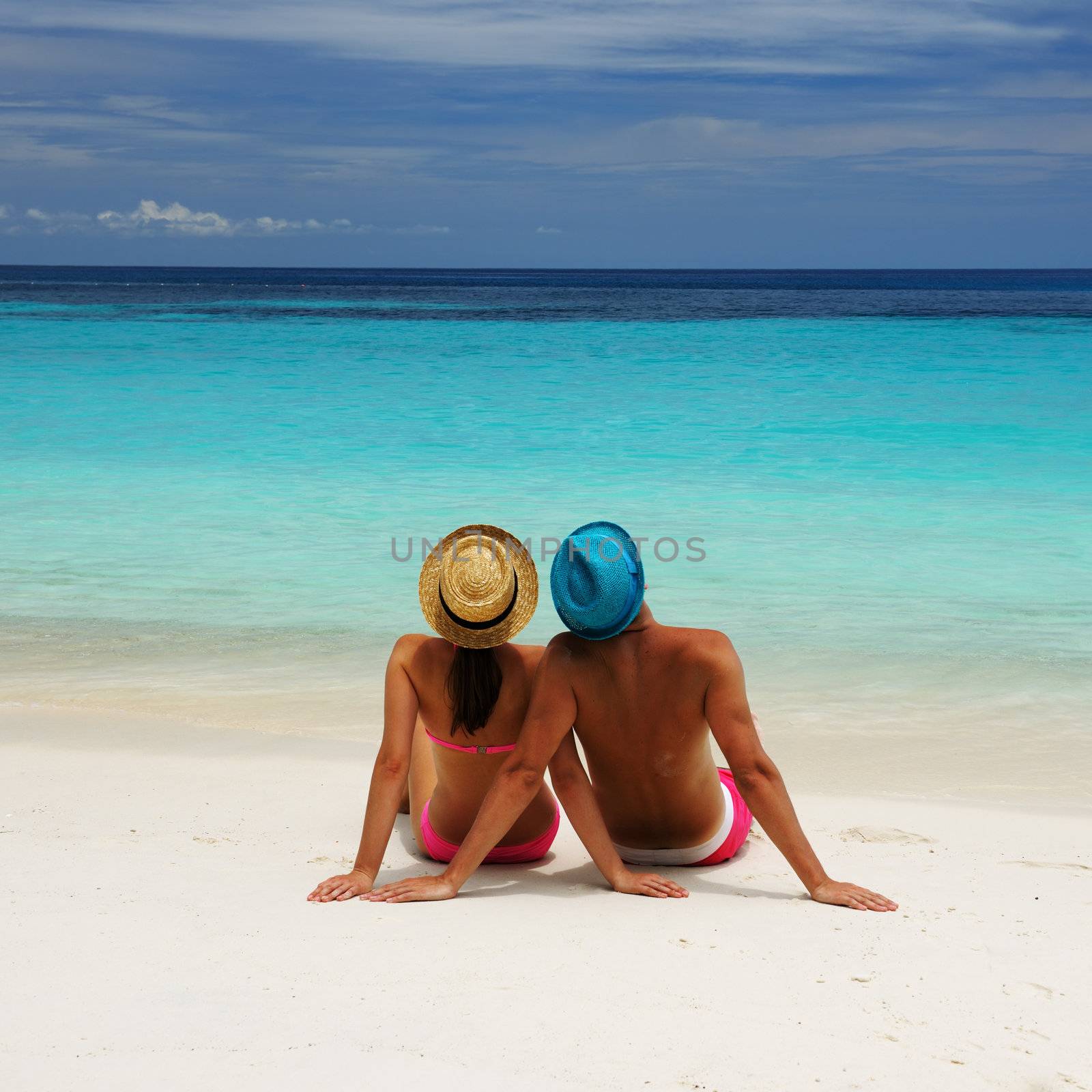 Couple on a beach by haveseen