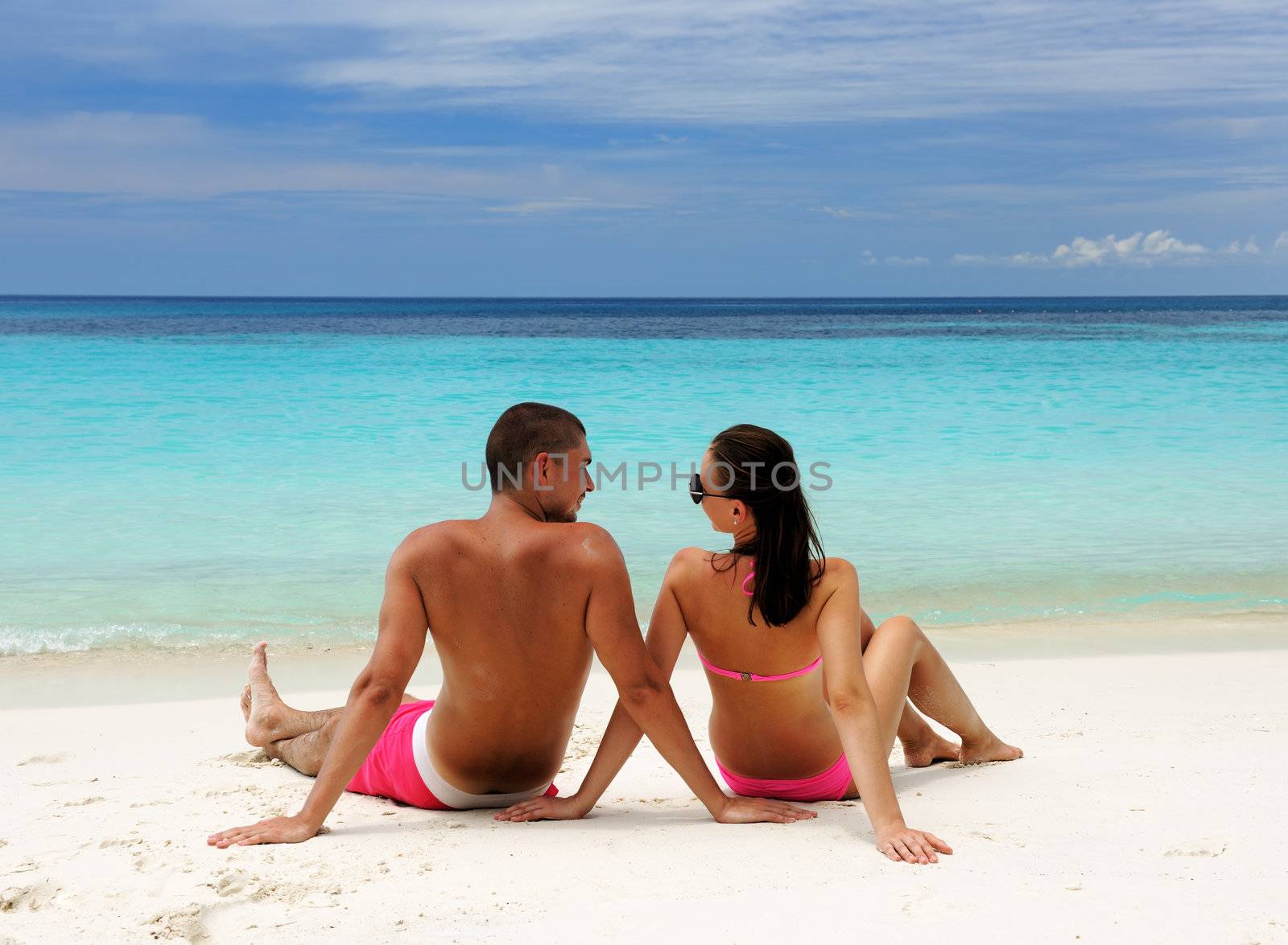Couple on a beach by haveseen