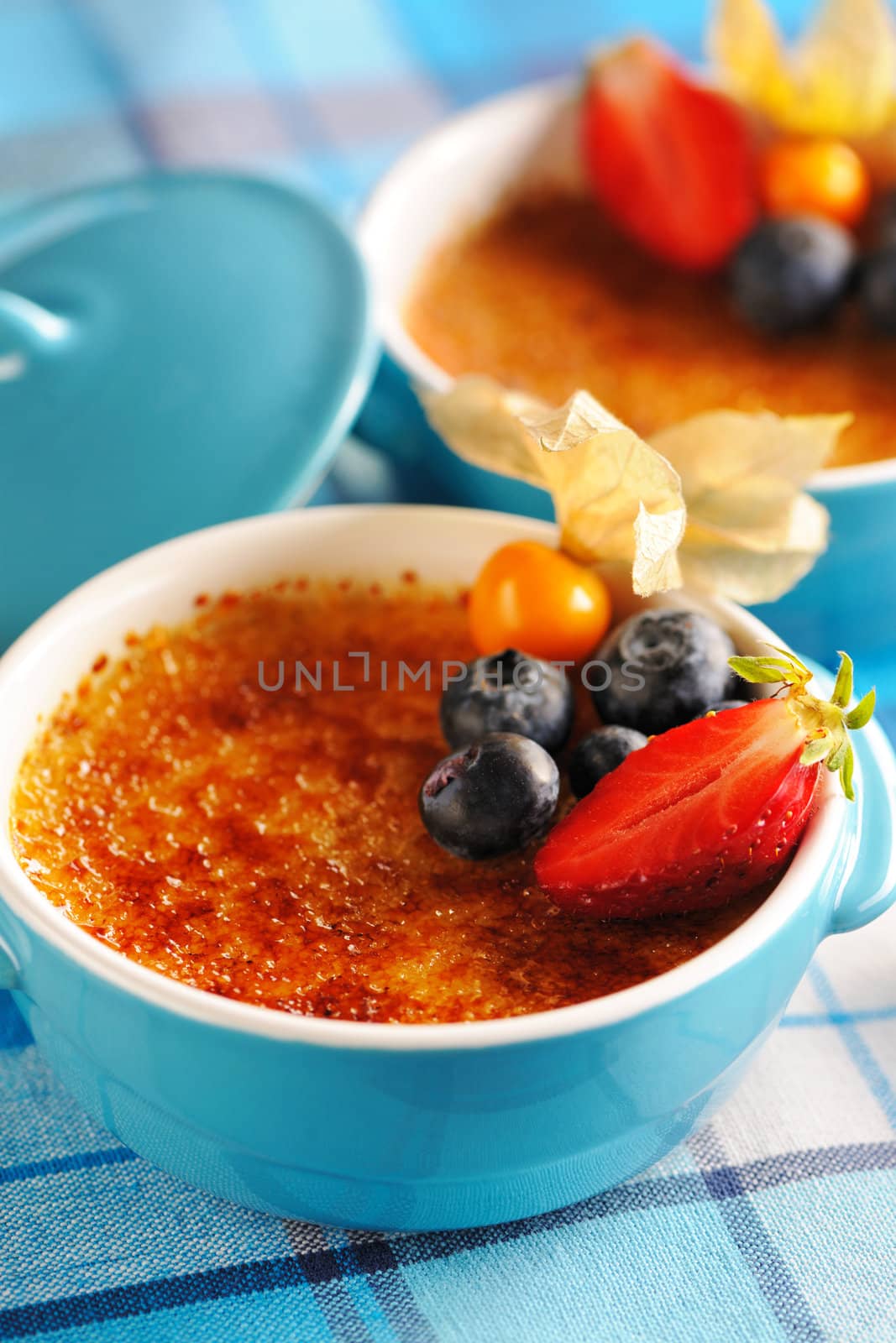 Creme brulee (cream brulee, burnt cream) with fruits and berries