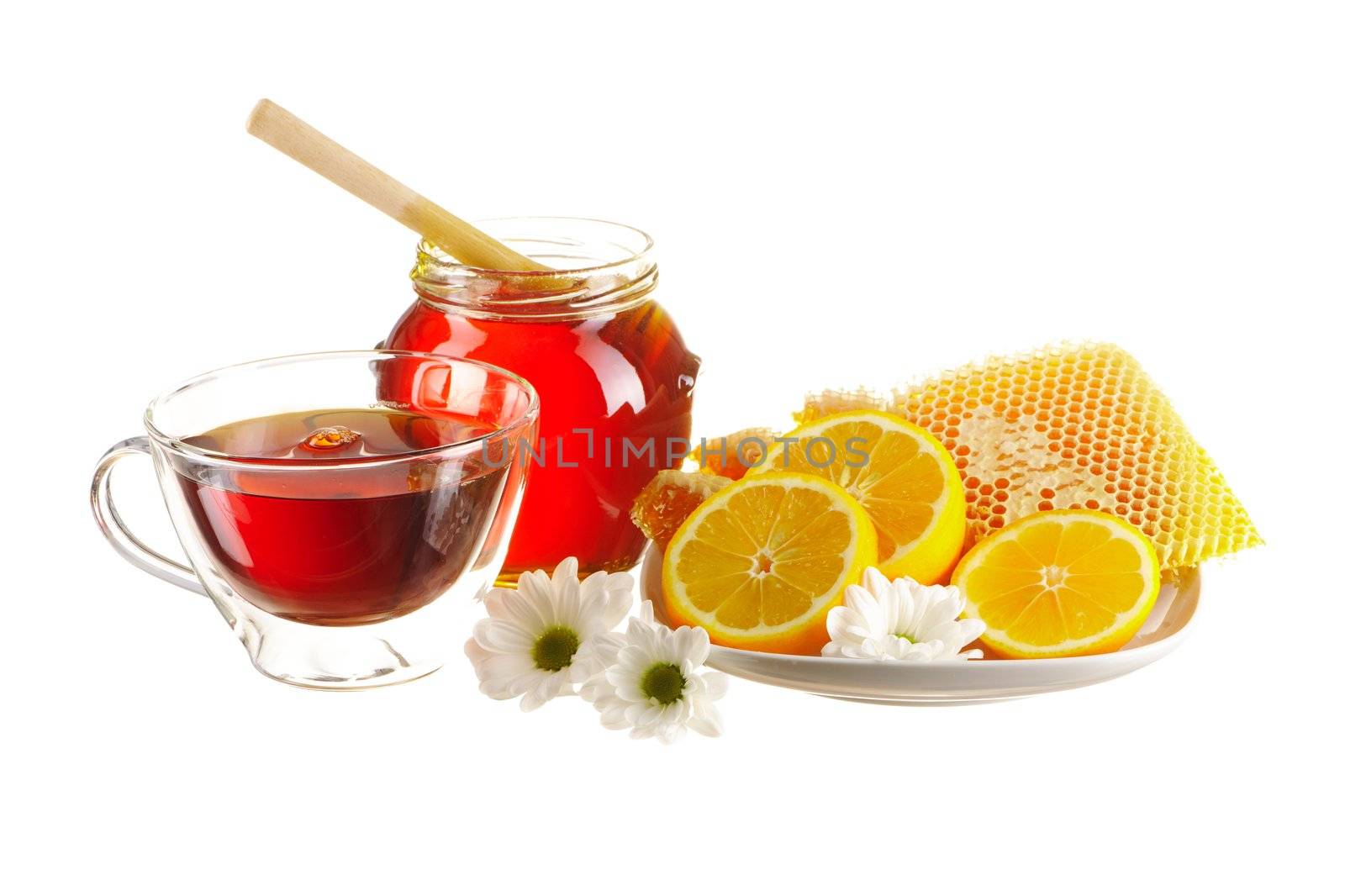 Jar of honey and tea cup isolated over white