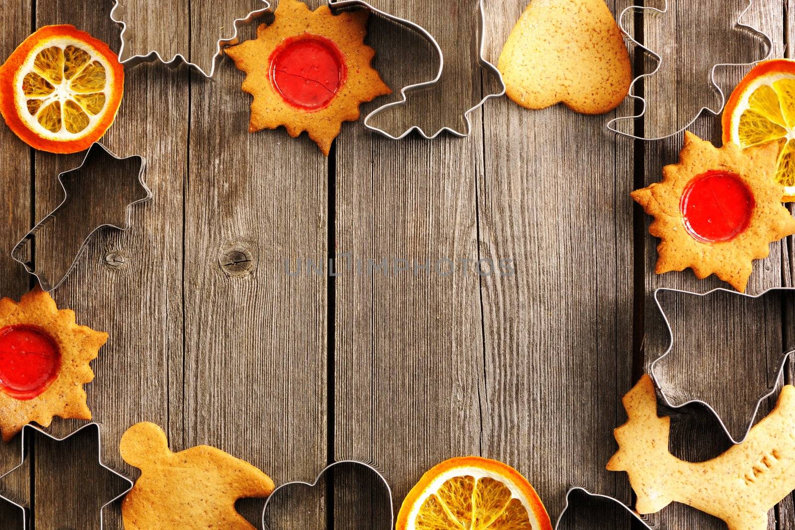 Christmas homemade gingerbread cookies over wooden table