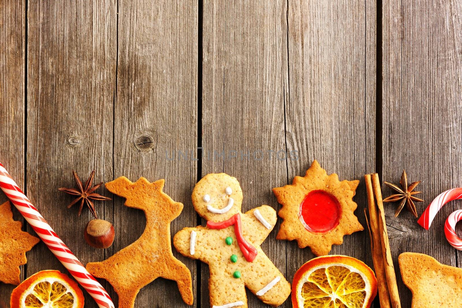 Christmas homemade gingerbread cookies over wooden table