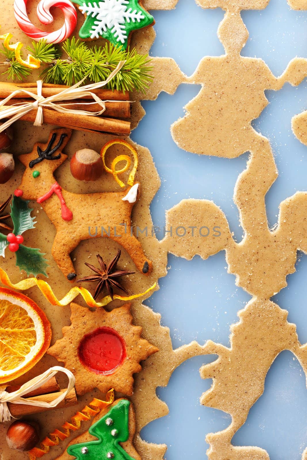Christmas spices and cookies over gingerbread dough by haveseen