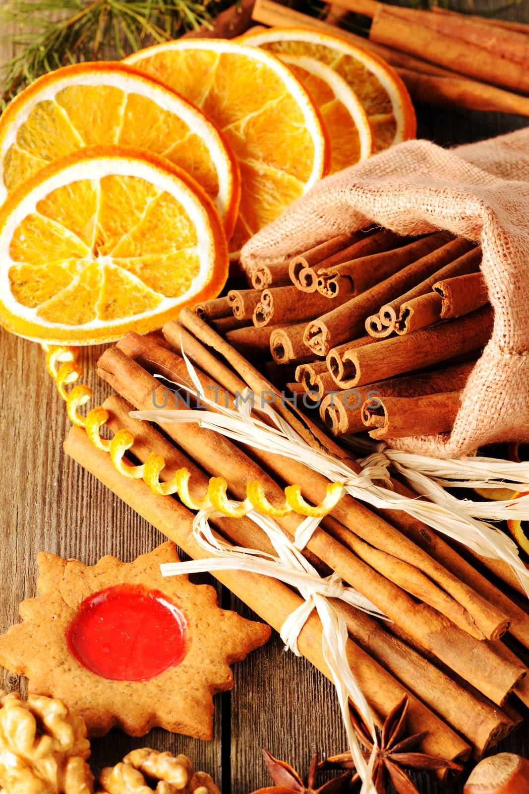 Christmas homemade gingerbread cookie and spices over wooden table