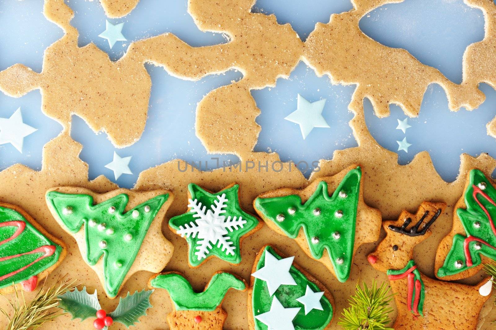 Christmas homemade gingerbread cookies over dough