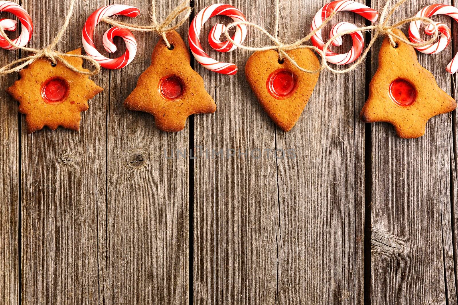 Christmas homemade gingerbread cookies over wooden table